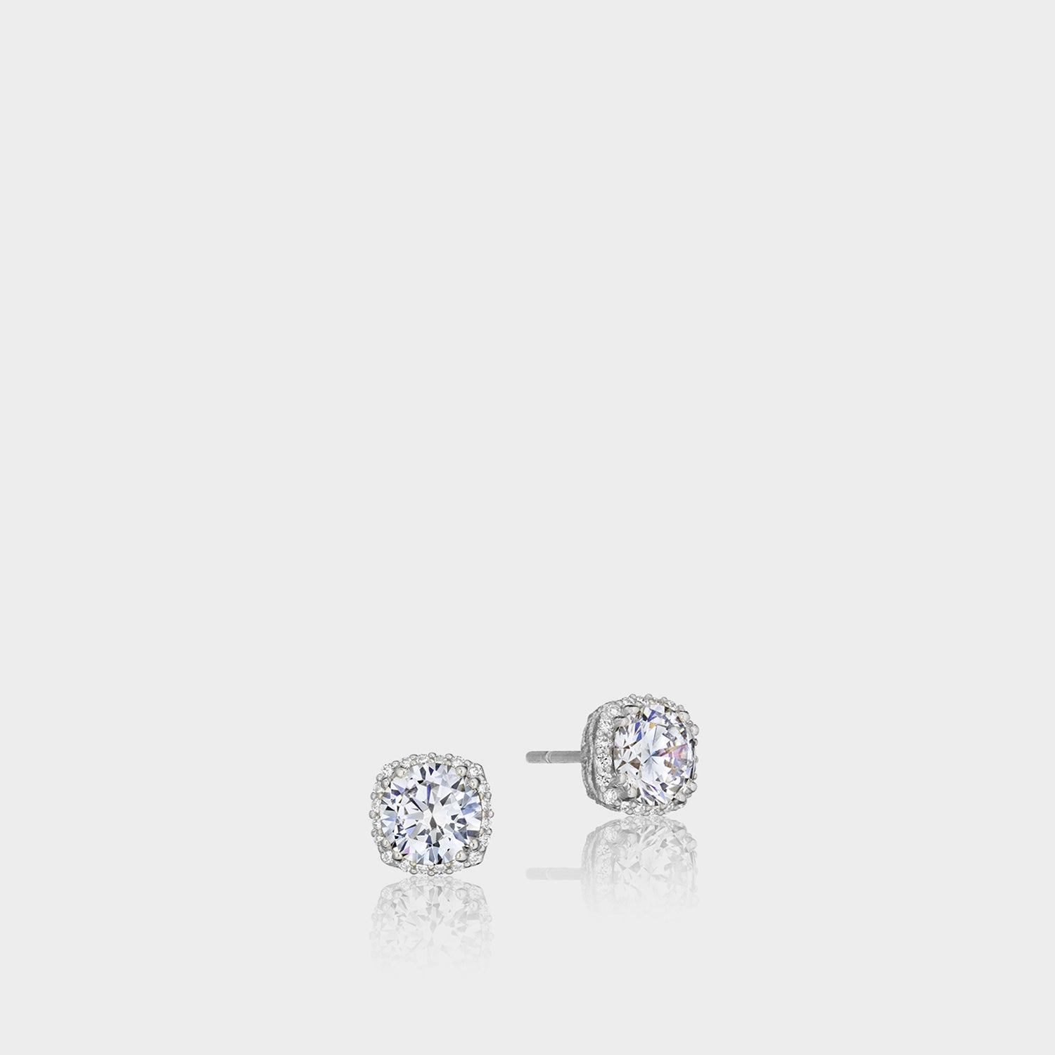18K White Gold Round Diamond Stud Earrings on grey background.
