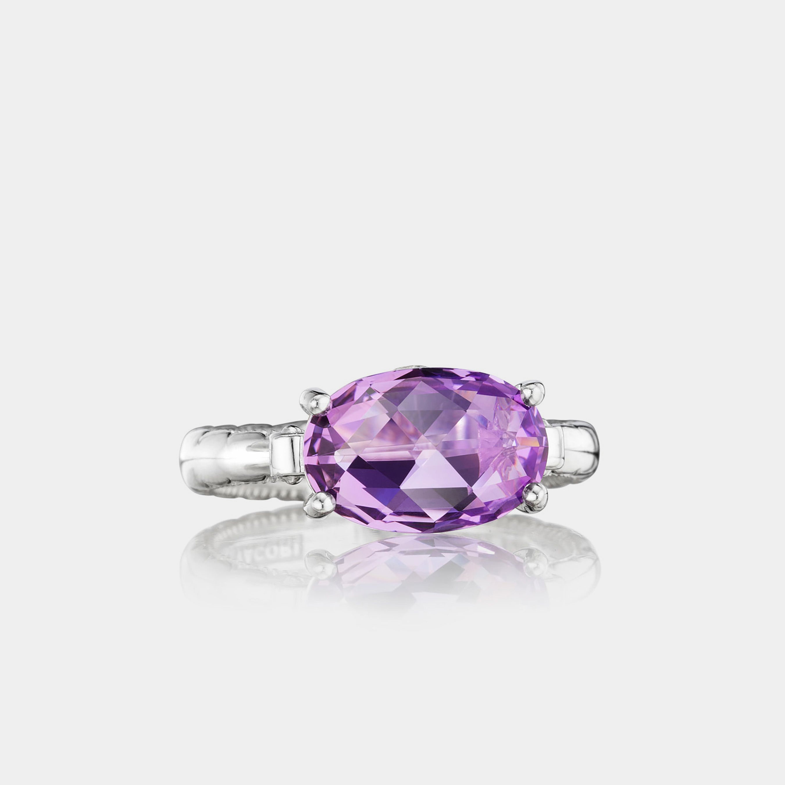 Sterling Silver and White Gold Oval Amethyst Ring on grey background.