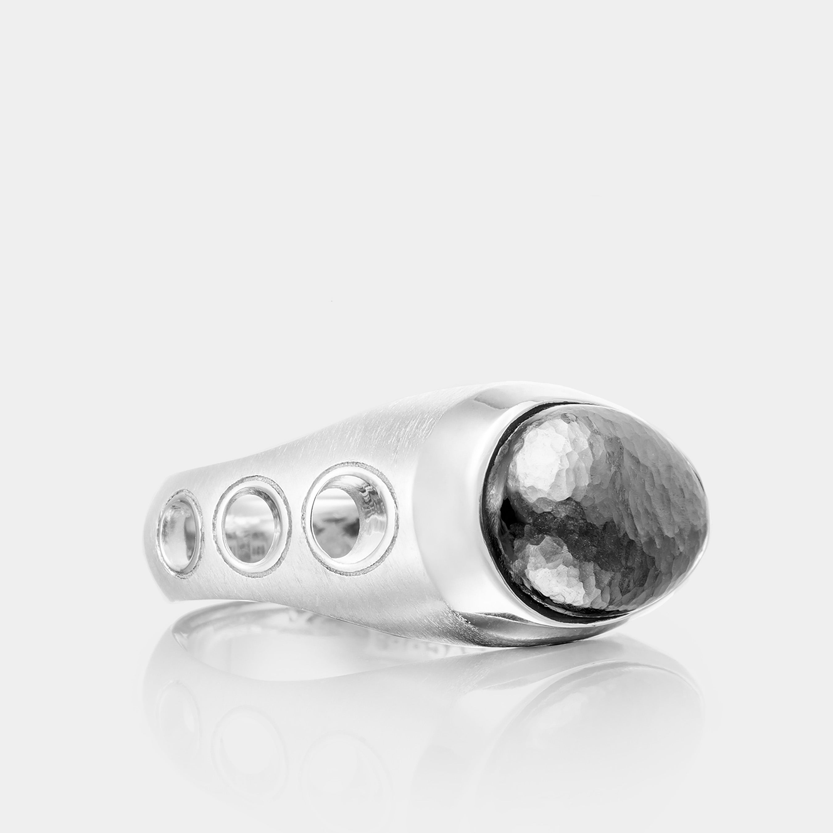 Men’s Sterling Silver Oval Silver Stone Ring on grey background, side angle