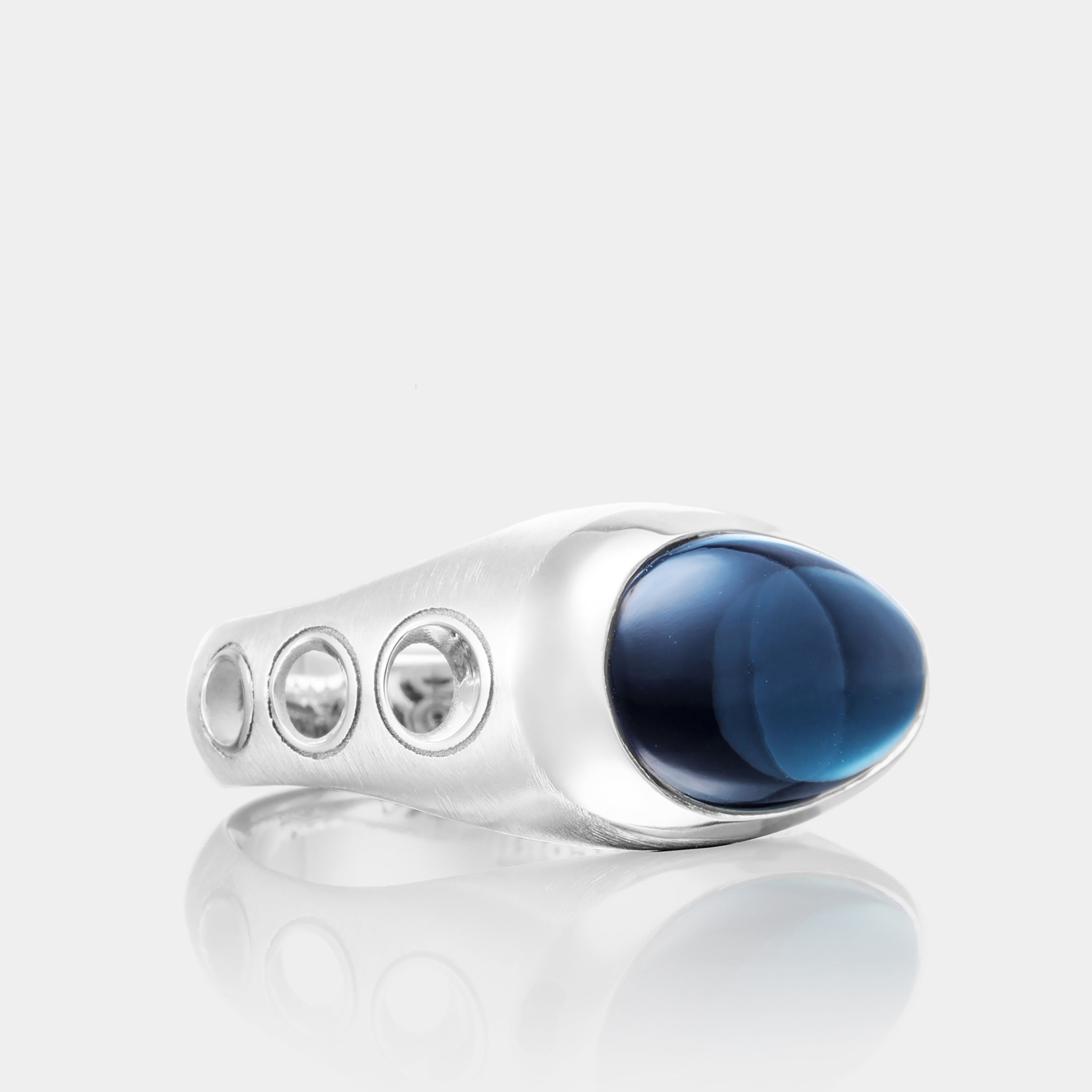 Men’s Sterling Silver Oval Sky Blue Hematite Fashion Ring on grey background, side view