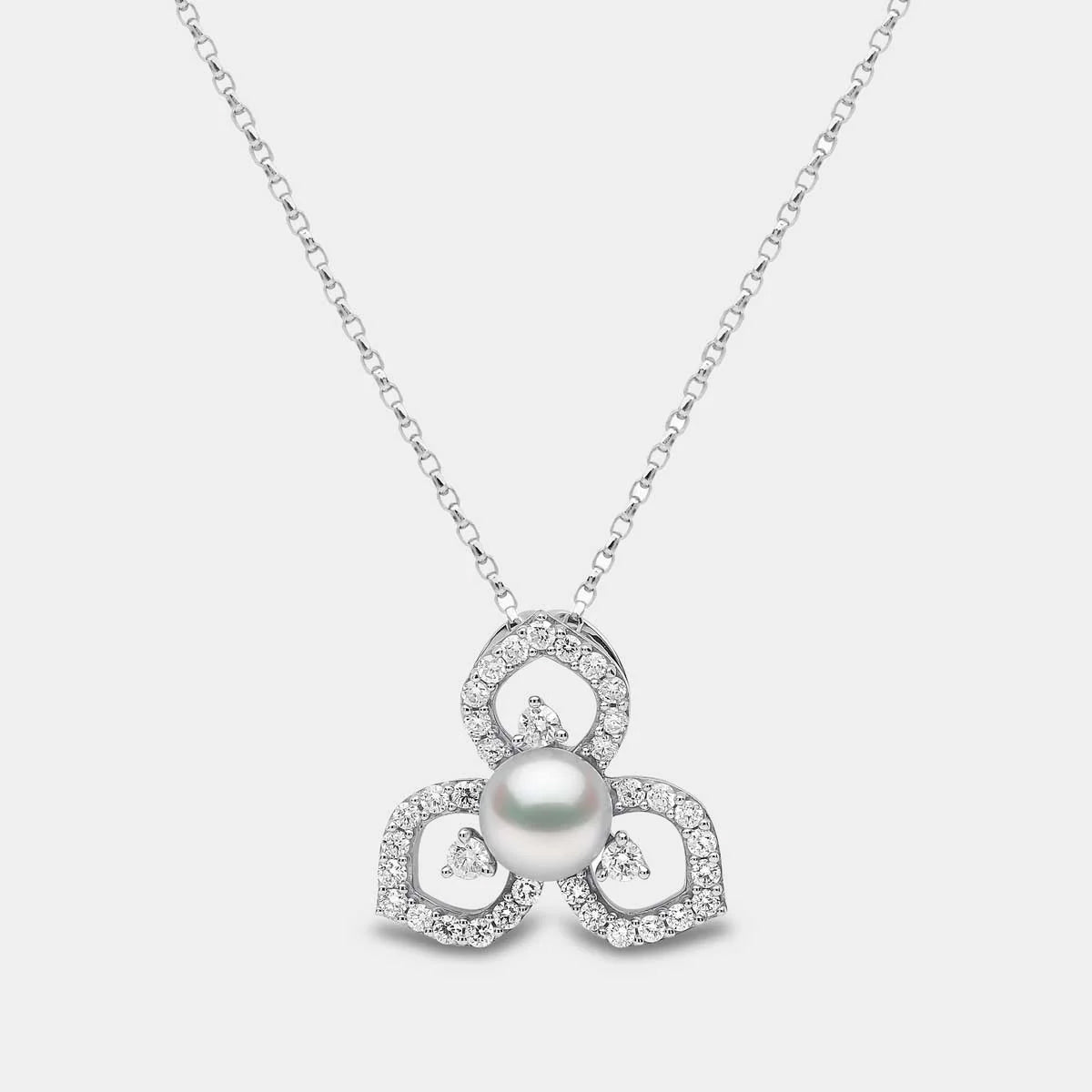White gold cable chain necklace with pearl pendant surrounded by floral design diamond accents on grey background, front view