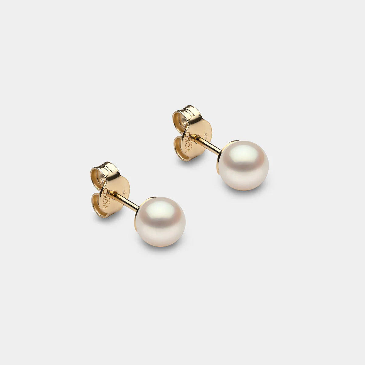 Classic yellow gold pearl stud earrings, front angle view