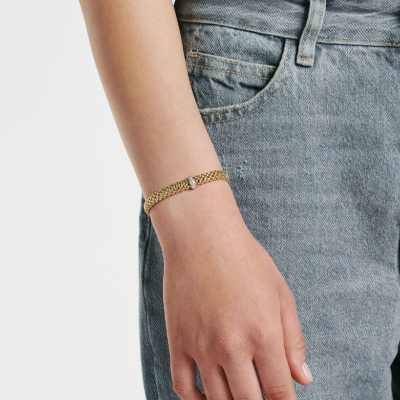 Women wearing yellow gold stretch bracelet