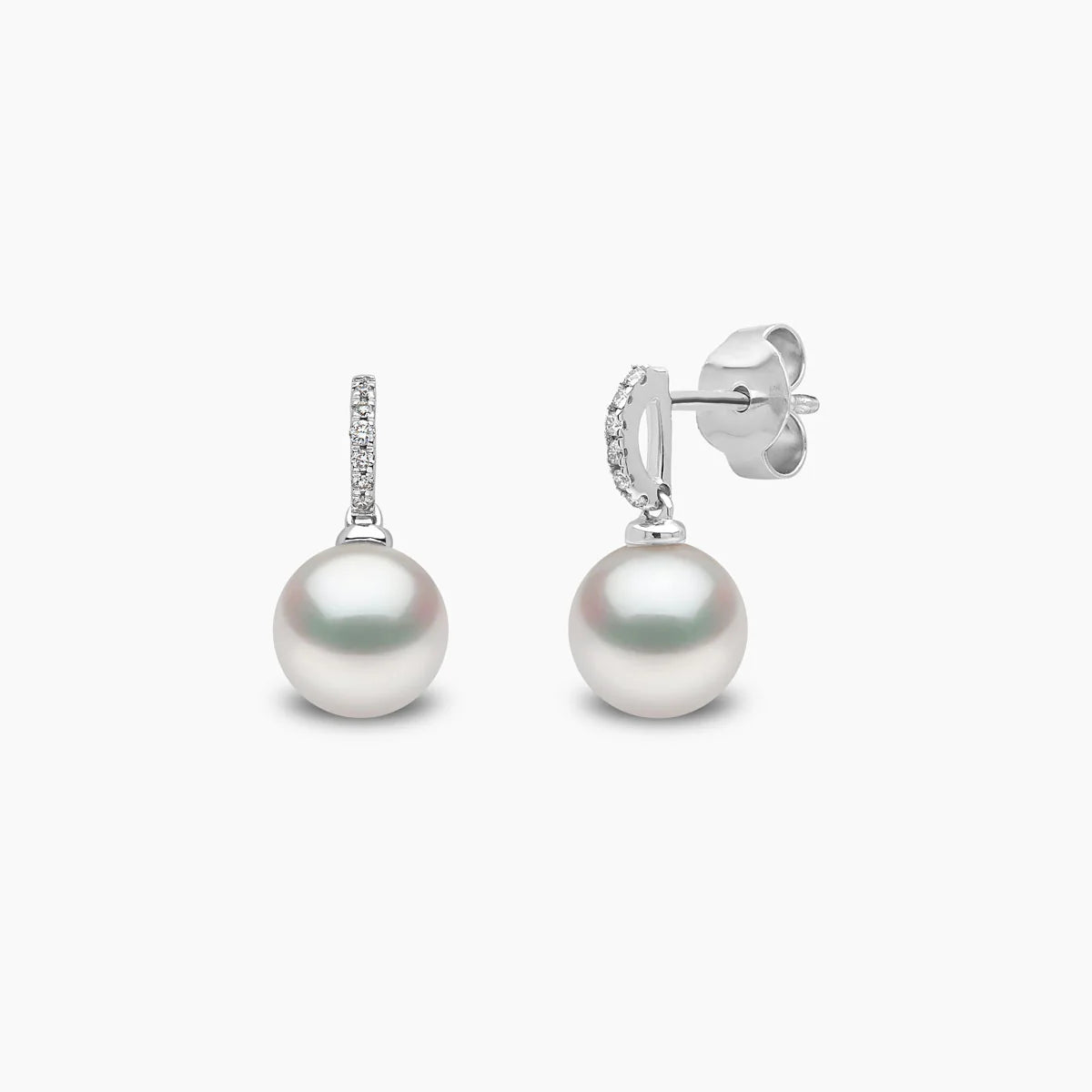 White gold pearl drop earrings with diamond accents, front and side angle view