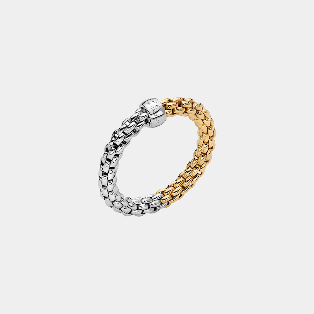 Yellow and white gold fashion ring on grey background