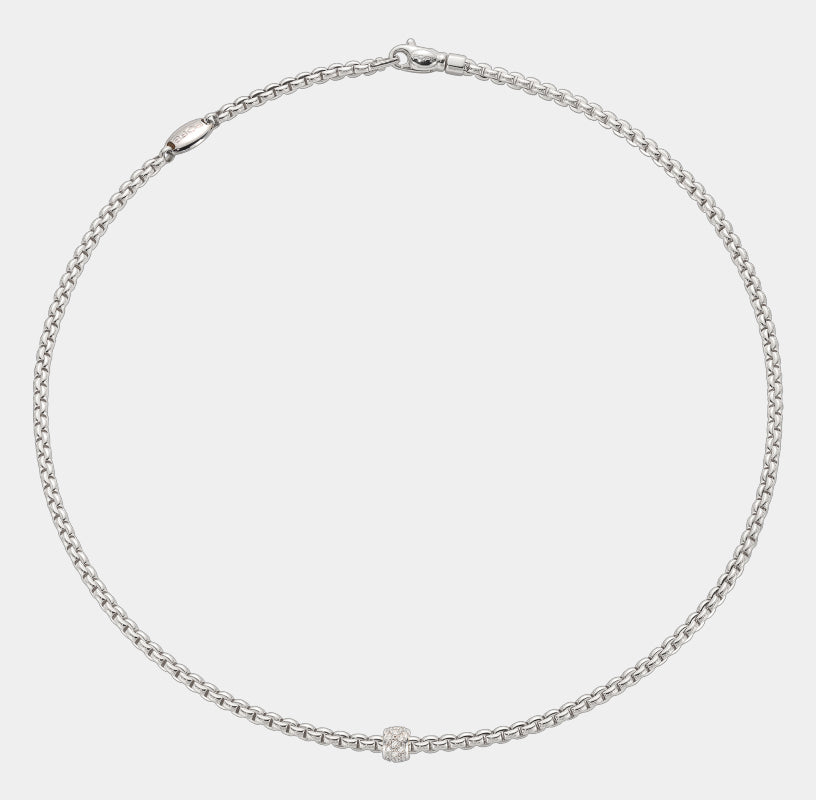 White gold diamond station necklace, flat lay view