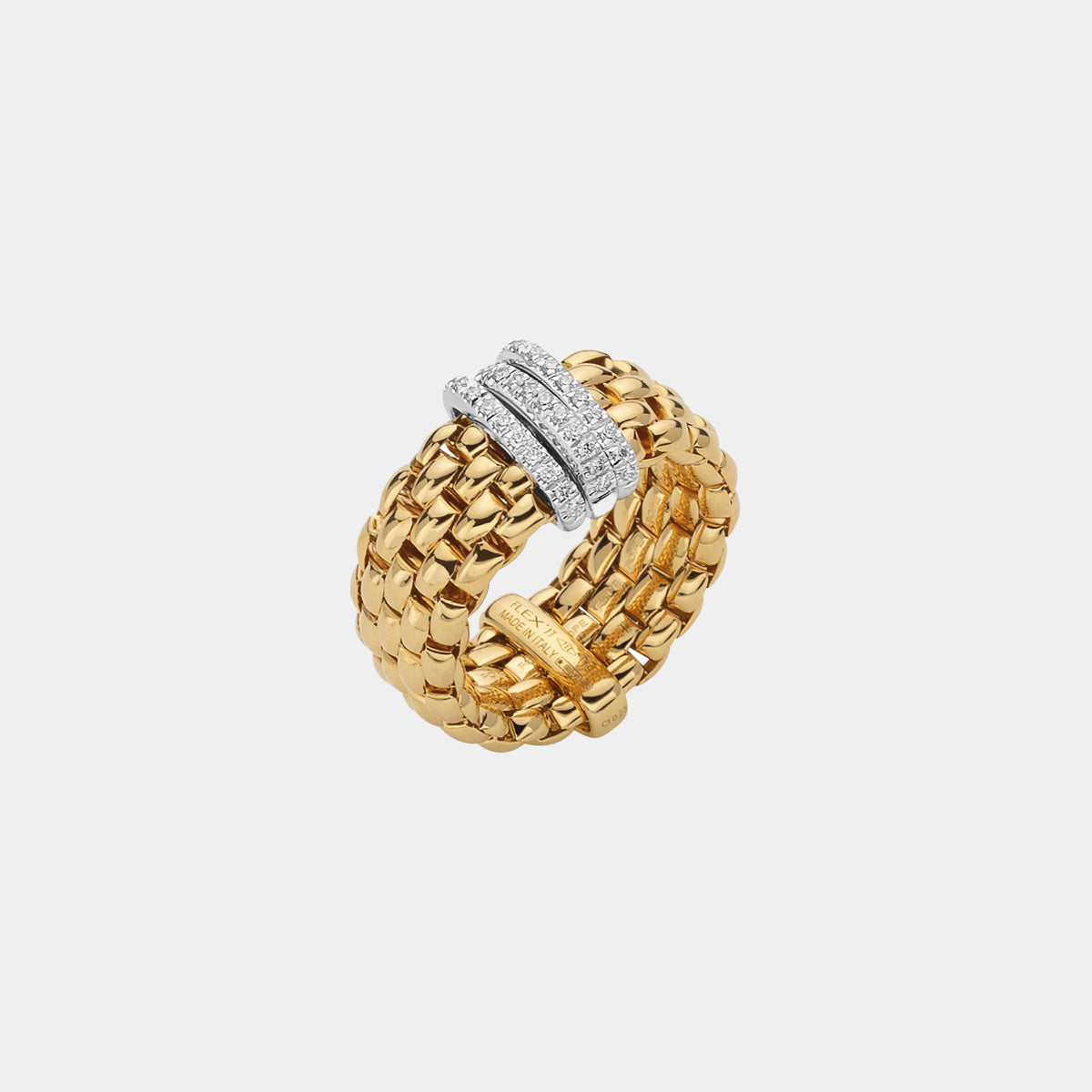 Yellow and white gold diamond fashion ring on grey background
