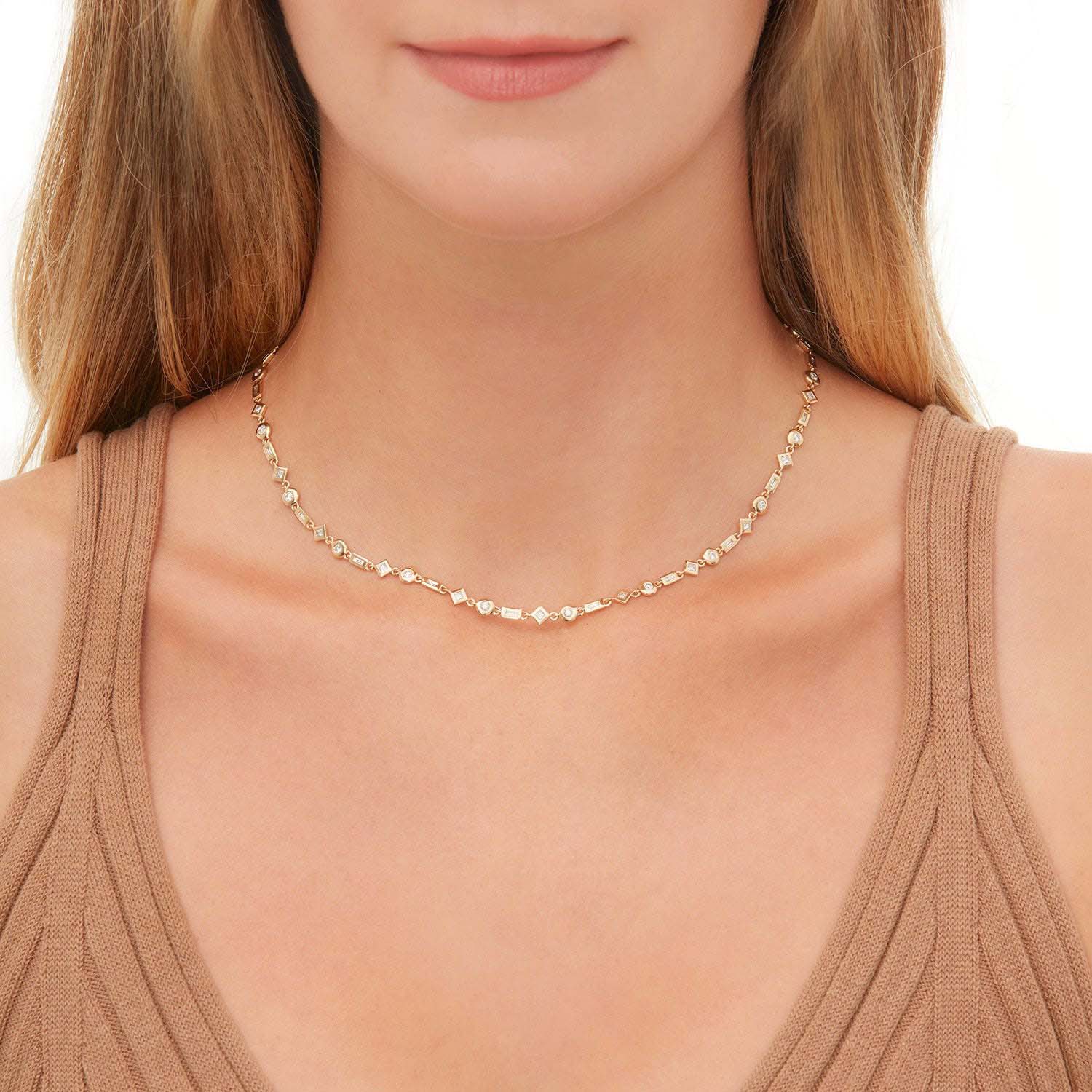 Woman wearing yellow gold mixed shape diamond tennis necklace