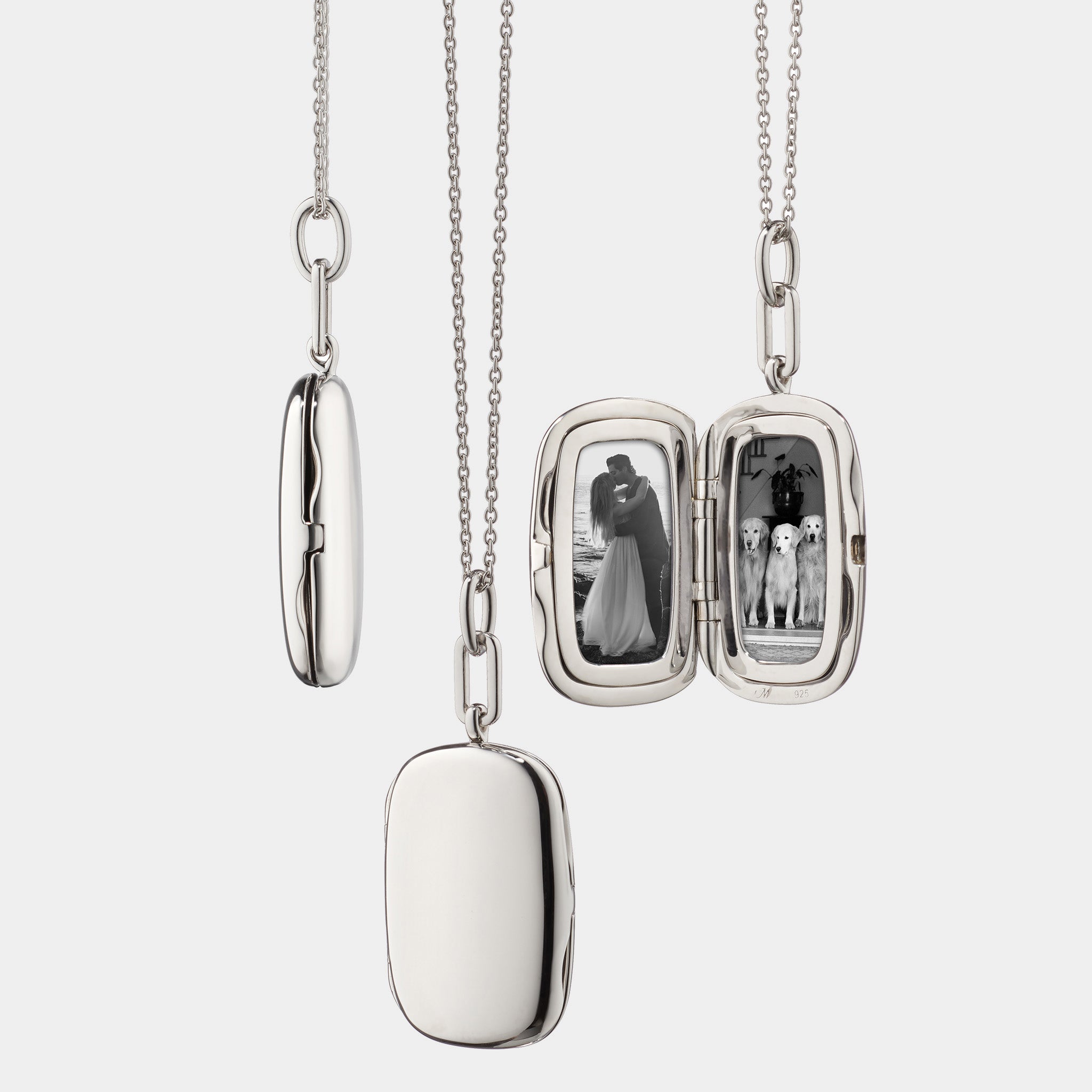 Sterling silver locket necklace on grey background