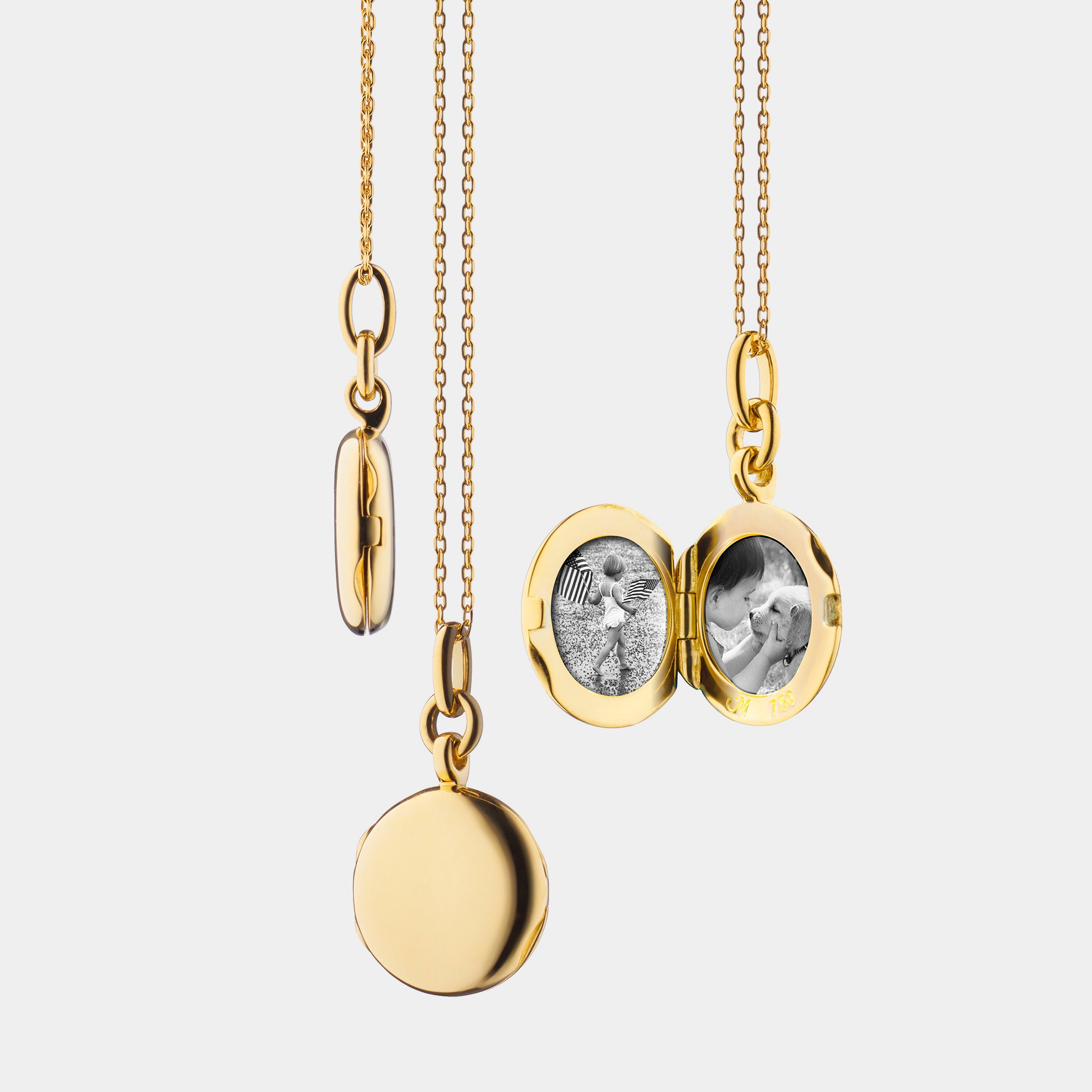 Yellow gold locket necklace on grey backgorund