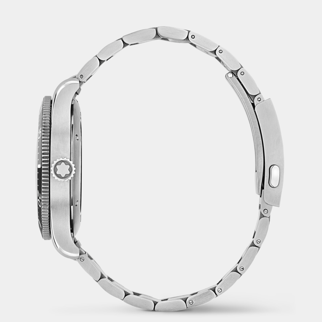 Close-up of a silver watch with a detailed bezel on a white background