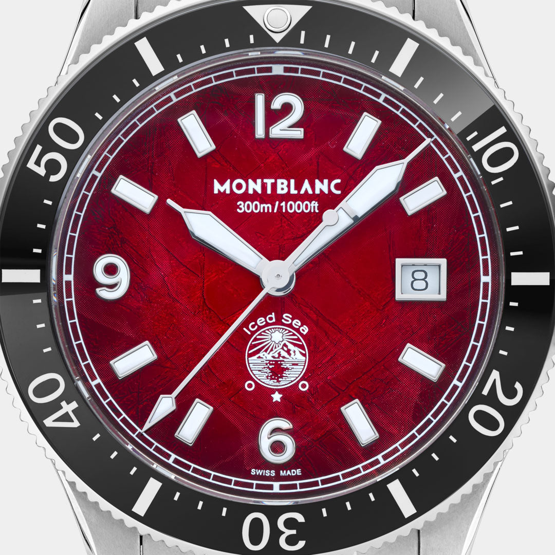 Montblanc watch with red face and black bezel on a white background