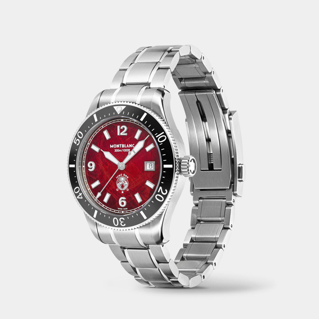 Silver watch with a red face on a light gray background