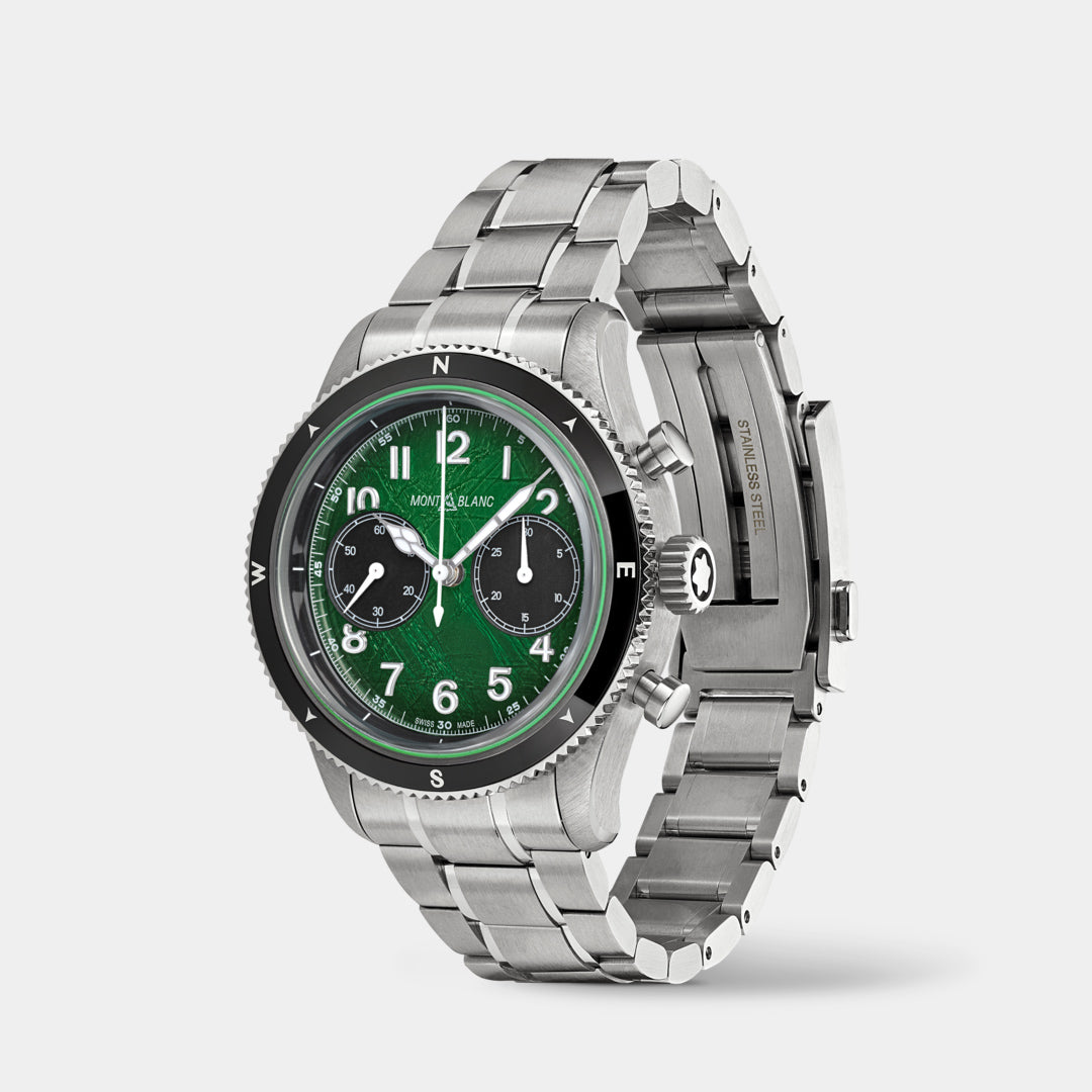 Silver watch with a green face on a white background