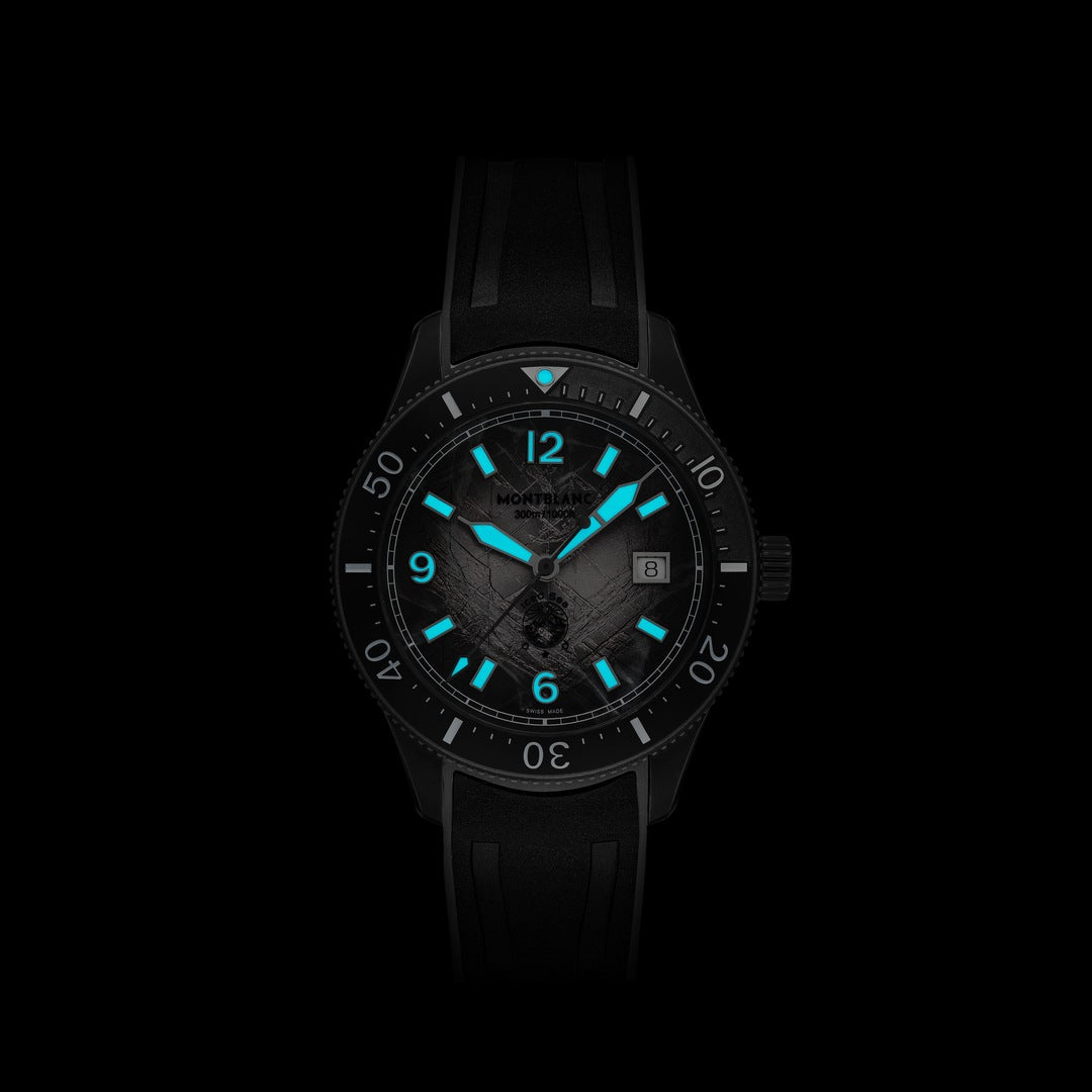 Black watch with blue glowing hands on a black background
