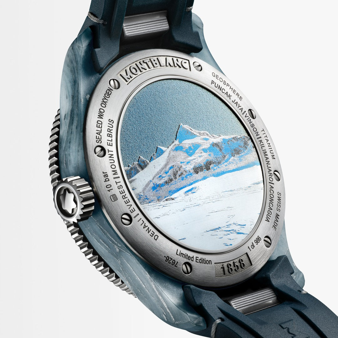 Watch with a mountainous landscape design on the dial against a white background