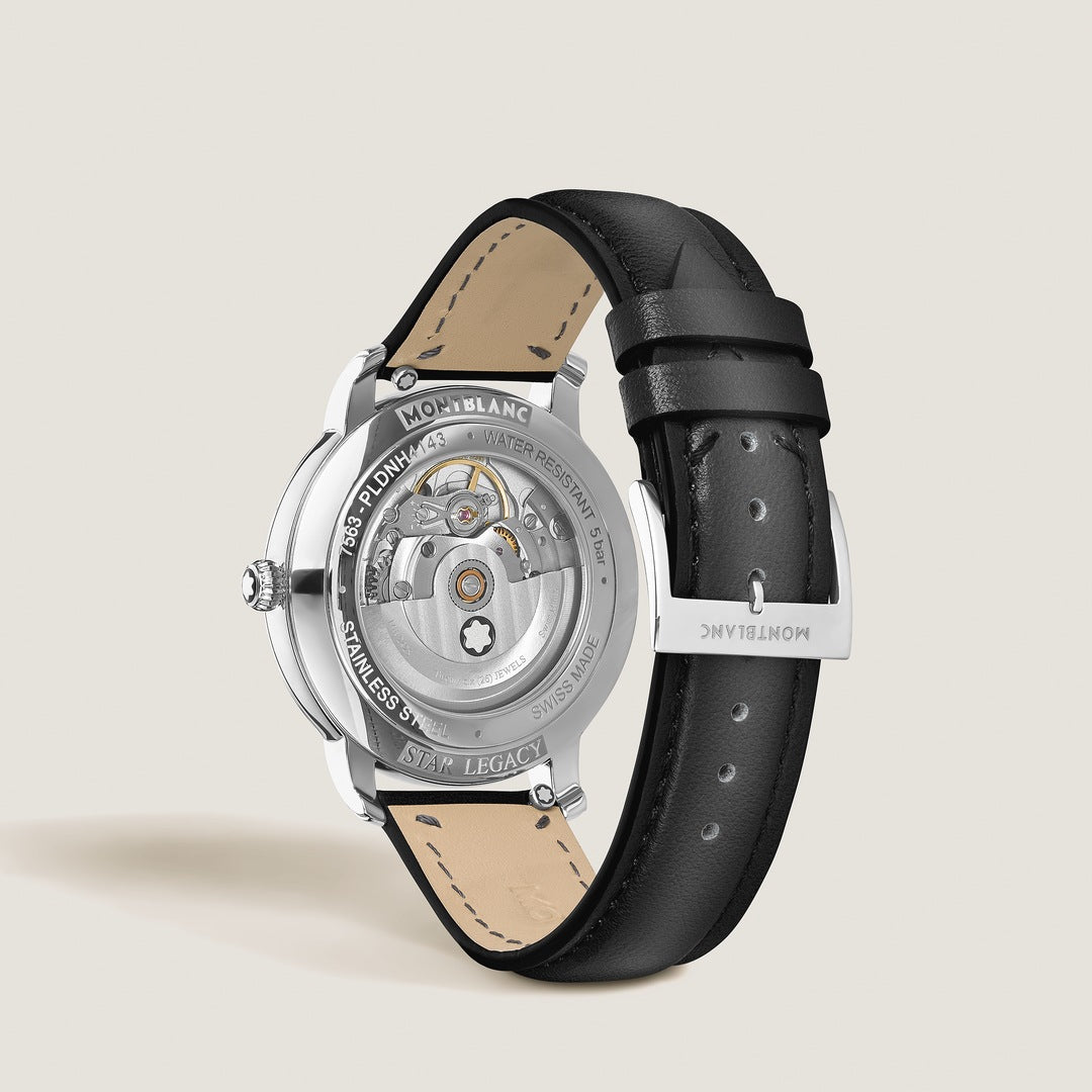 Montblanc watch with black leather strap on a light beige background