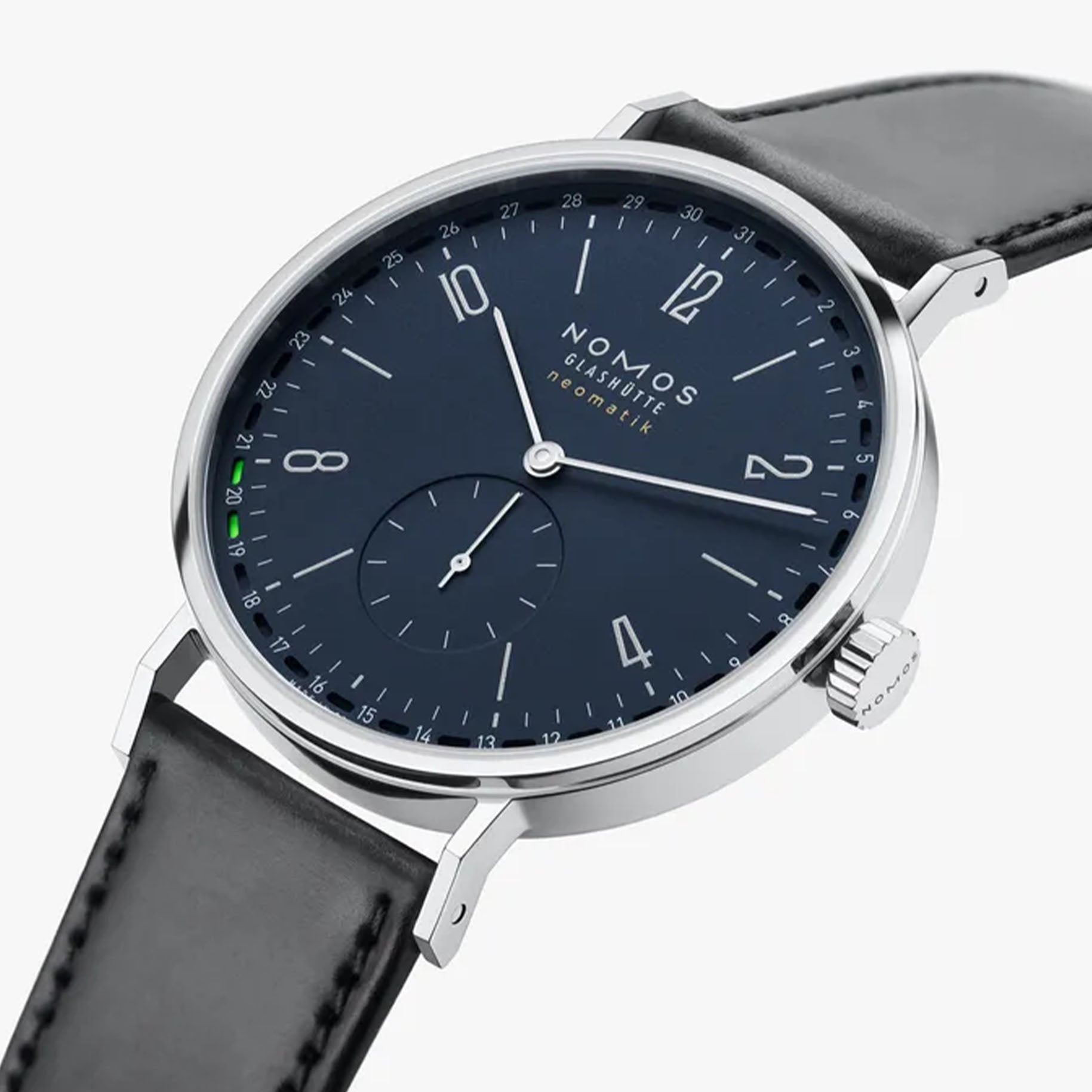 NOMOS Glashütte Tangente Neomatik 41mm watch with midnight blue dial, stainless steel case, and black leather strap on white background, side angle view.