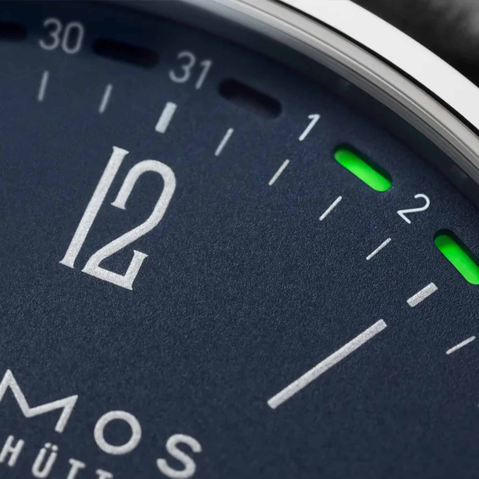 NOMOS Glashütte Tangente Neomatik 41mm watch with midnight blue dial, date display closeup.