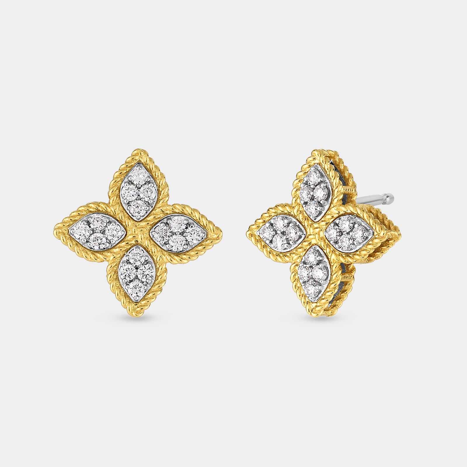 Yellow gold diamond flower stud earrings on gray background.