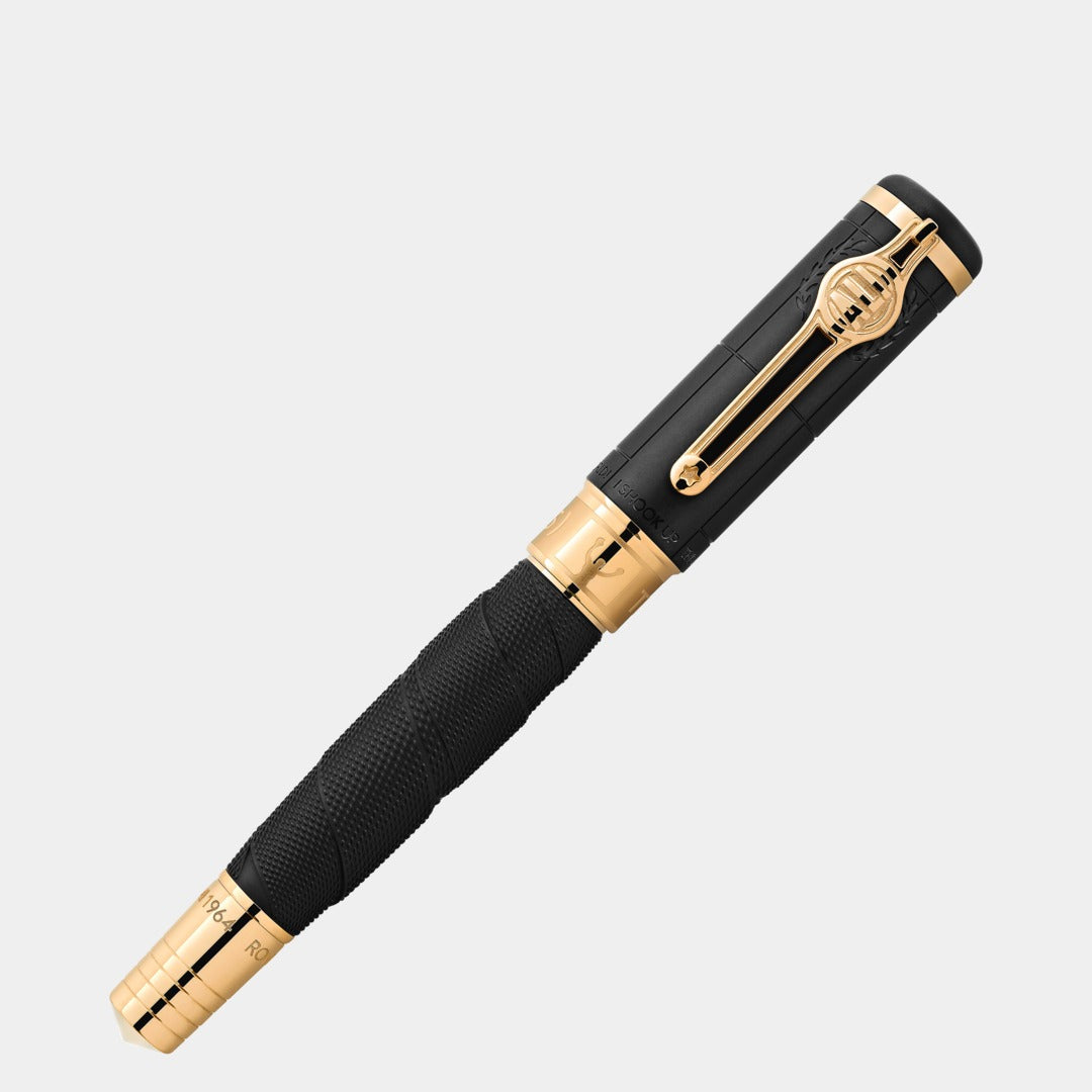 Black and gold pen on a light gray background