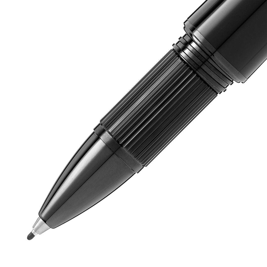 Close-up of a black pen on a white background