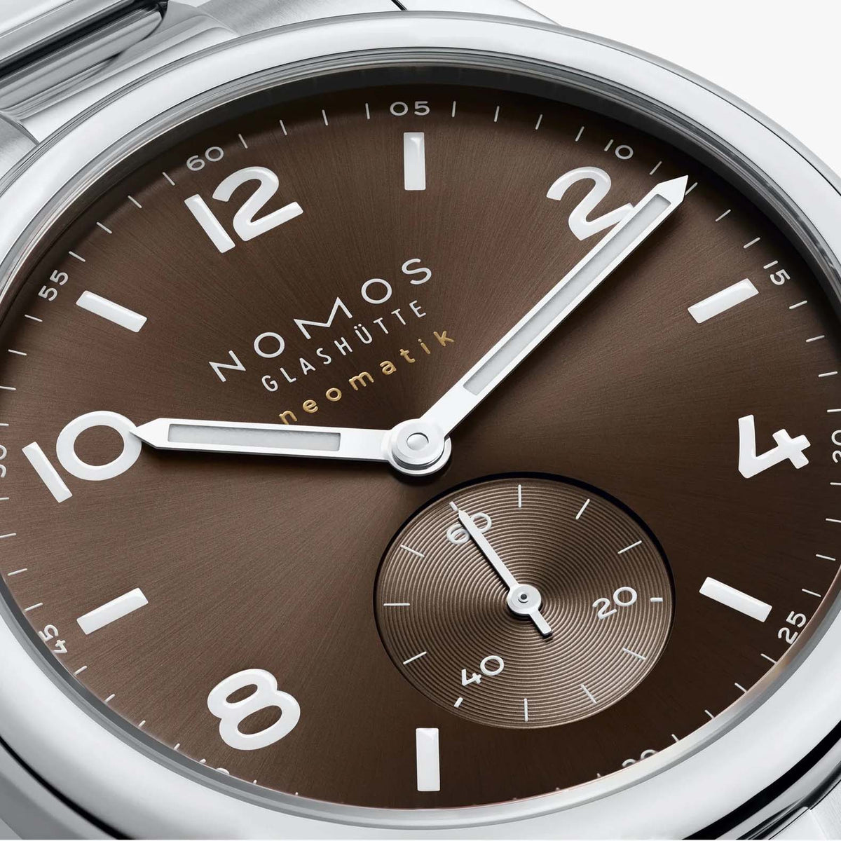 NOMOS Glashütte Club Sport Neomatik 39mm watch with tabac brown sunburst dial, luminous hands, closeup of dial