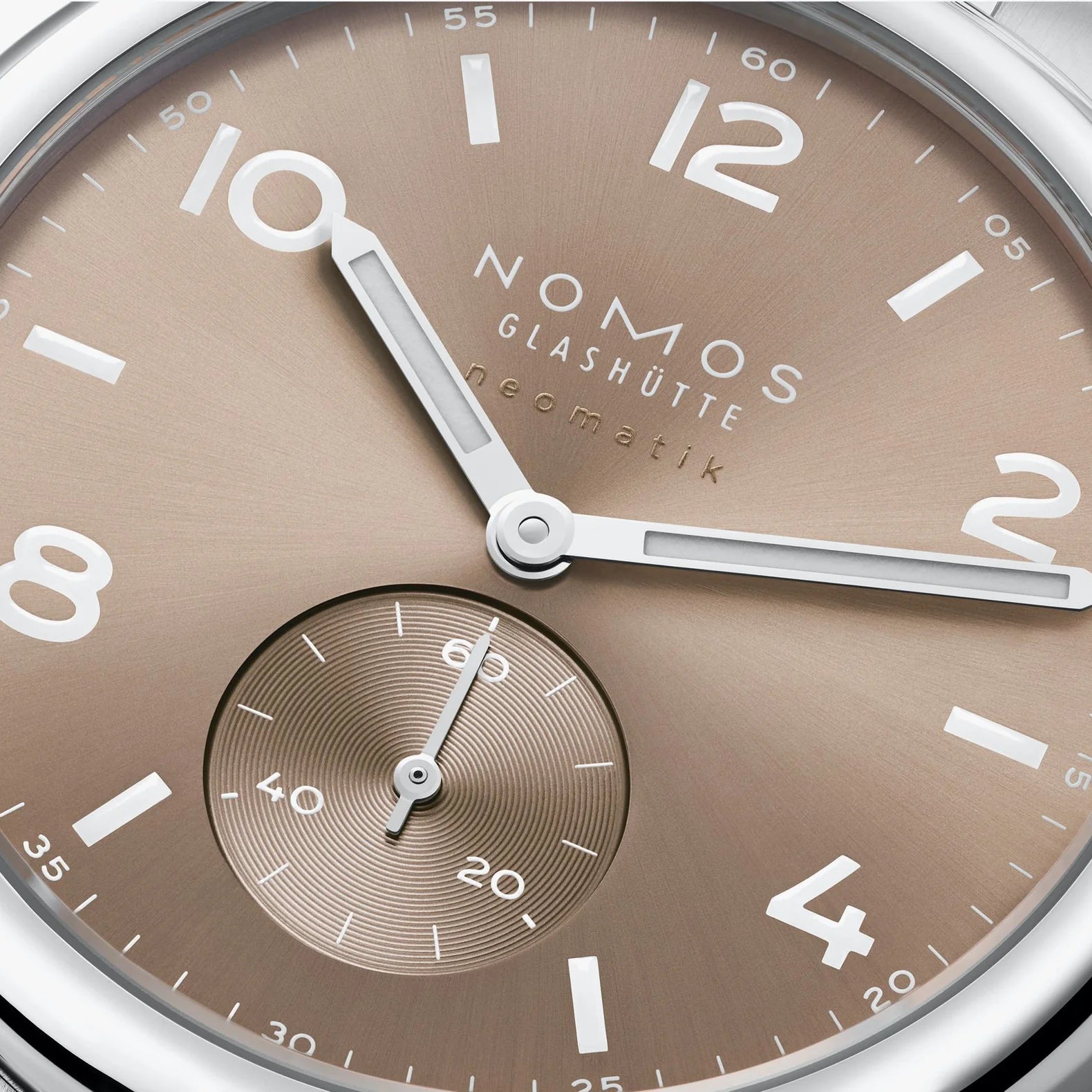 NOMOS Glashütte Club Sport Neomatik 39mm watch with ember beige-gold sunburst dial, luminous hands, dial closeup.