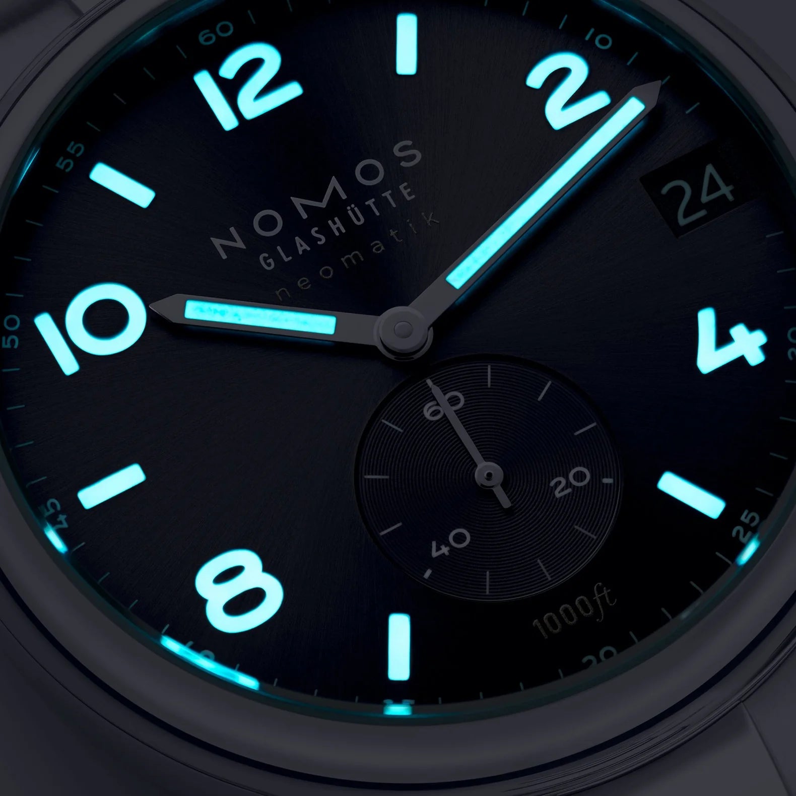 Nomos Glashütze watch face with glowing blue numbers and markers on a dark background