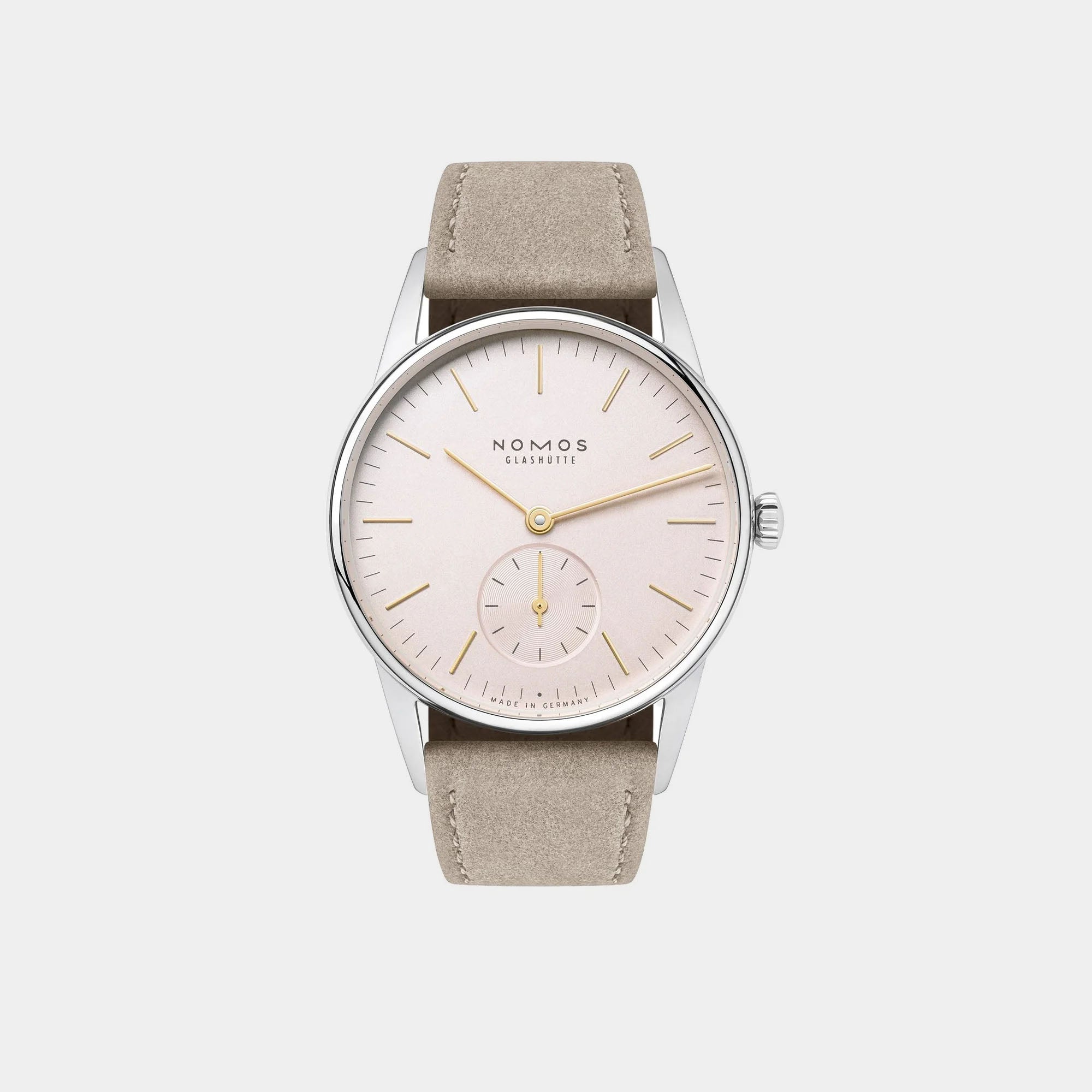 NOMOS Glashütte Orion 33mm watch with blush pink dial, stainless steel case, and light vegan velour strap on grey background, front angle view.