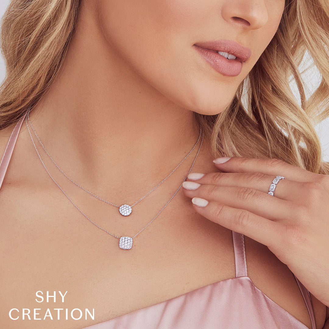 Woman wearing white gold baguette diamond stacker ring