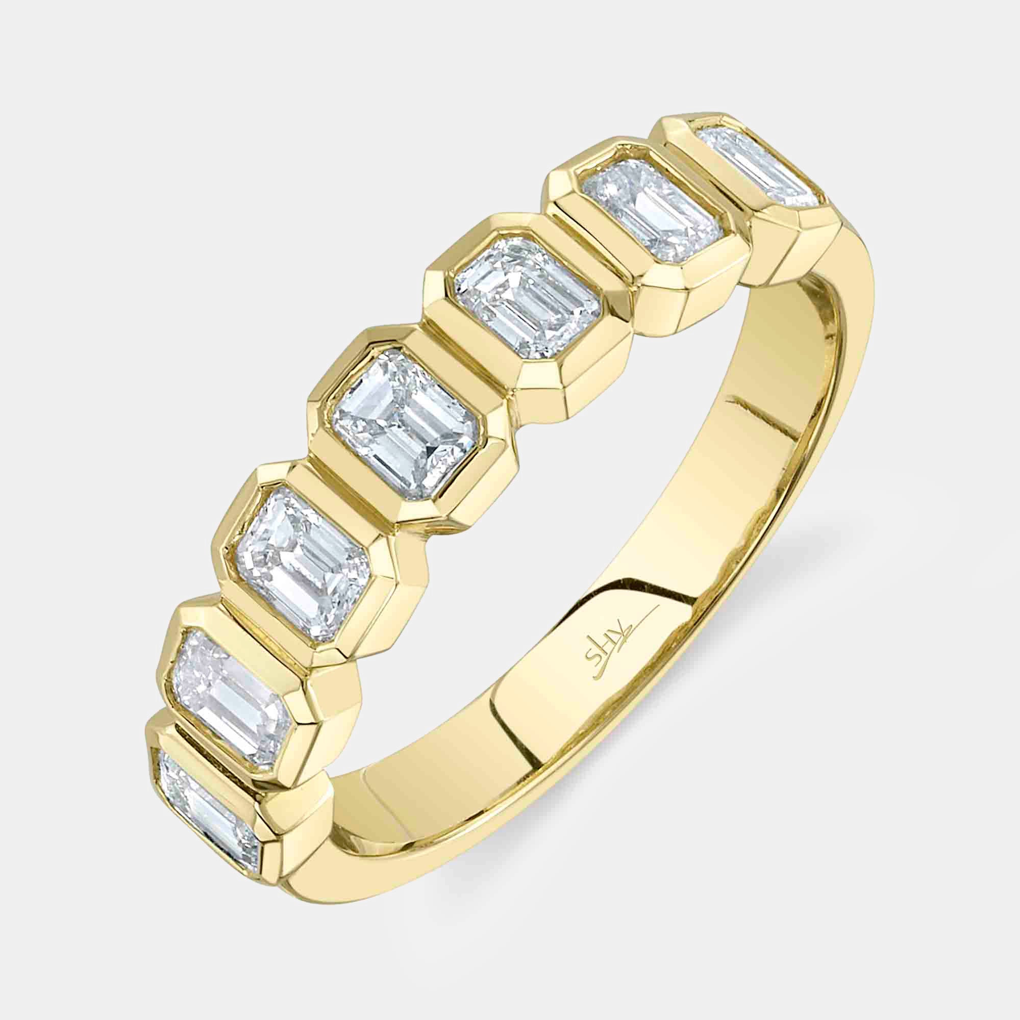 Yellow gold emerald cut diamond fashion ring, top angle view
