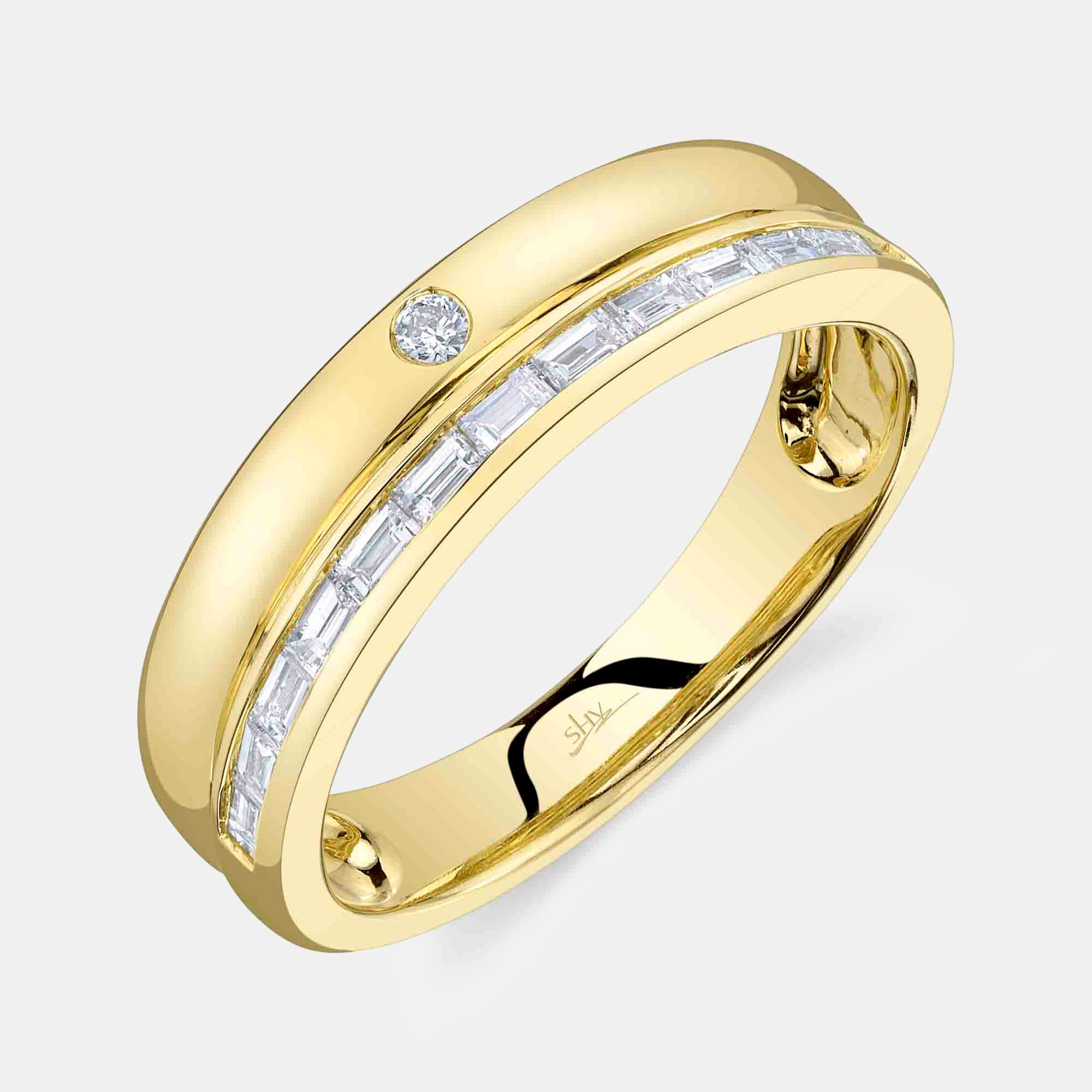 Yellow gold channel set baguette diamond fashion ring, top angle view