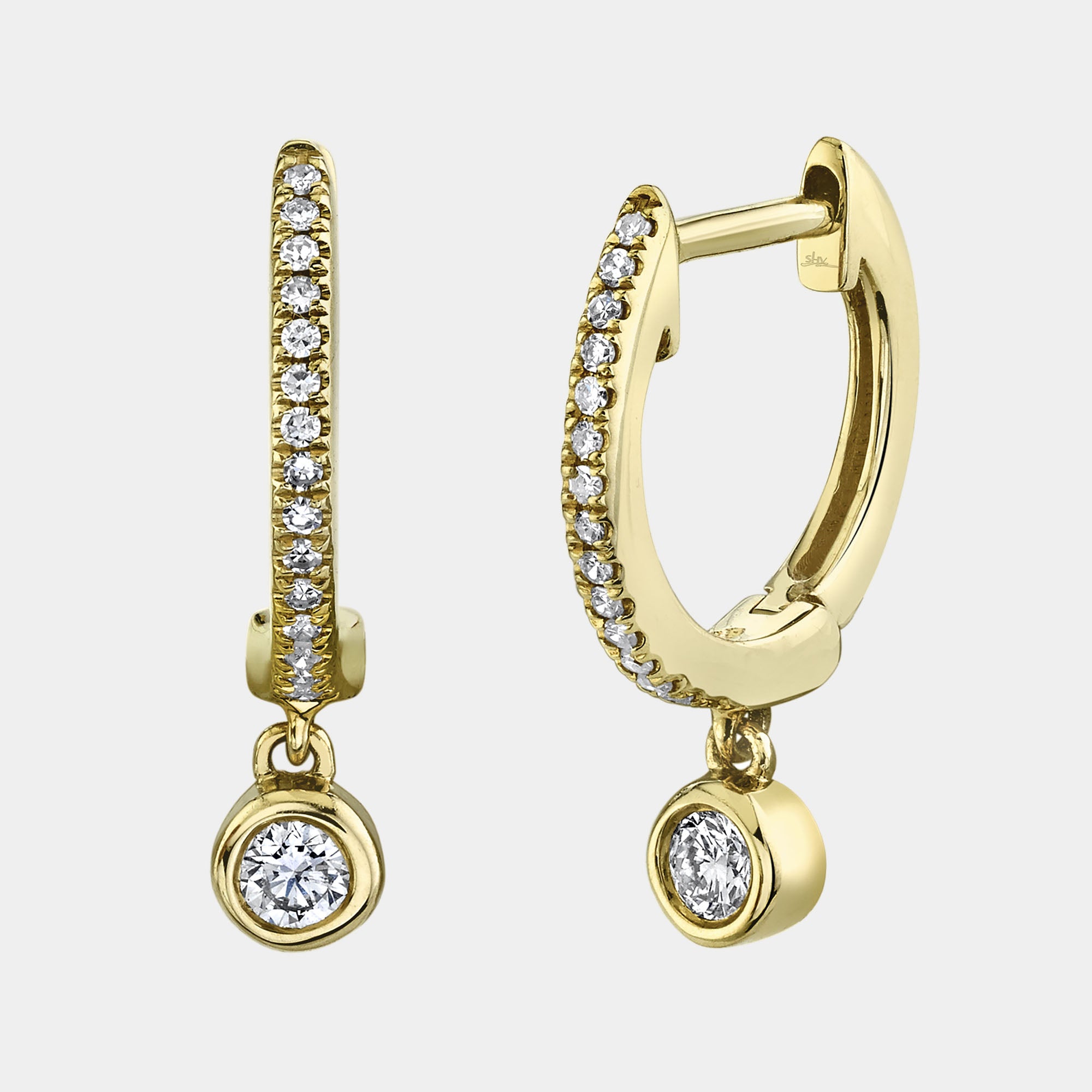Yellow gold bezel set diamond huggie earrings, front upright view