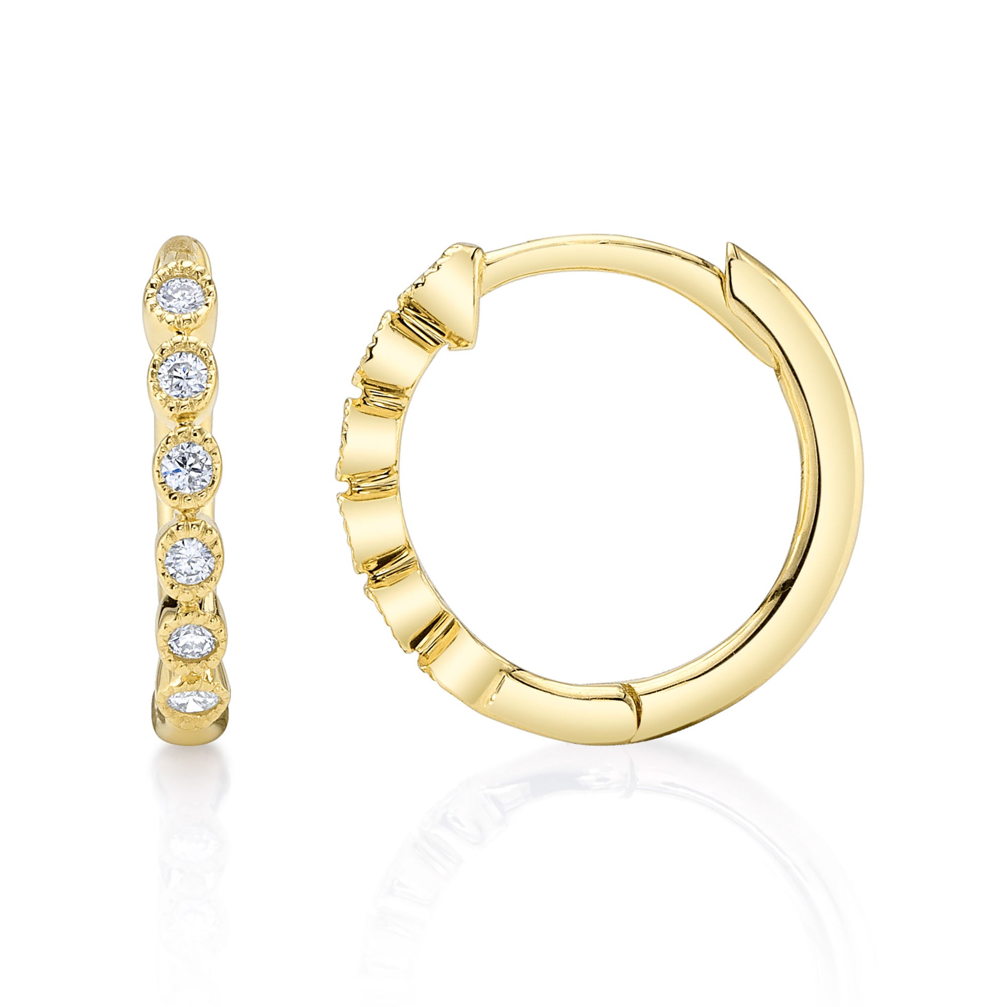 Yellow gold diamond huggie earrings, side angle view