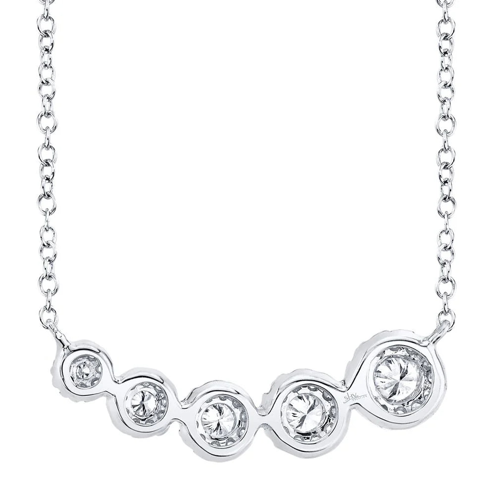 White gold diamond necklace with five diamond solitaire pendants, back view