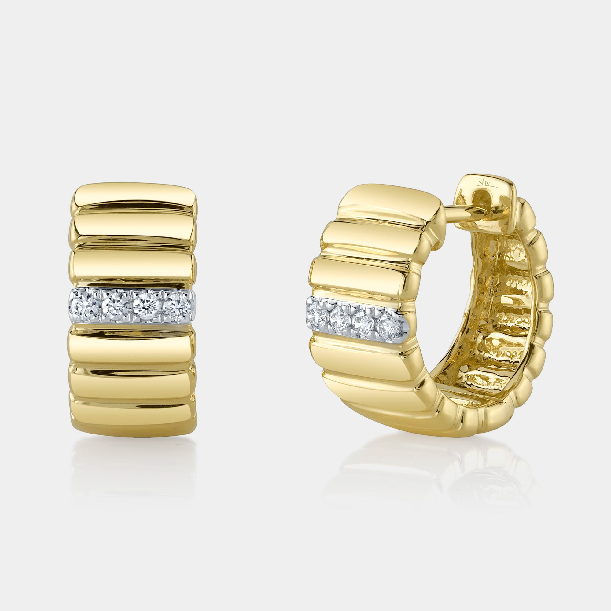 Yellow gold diamond ribbed huggie earrings, front and angle view
