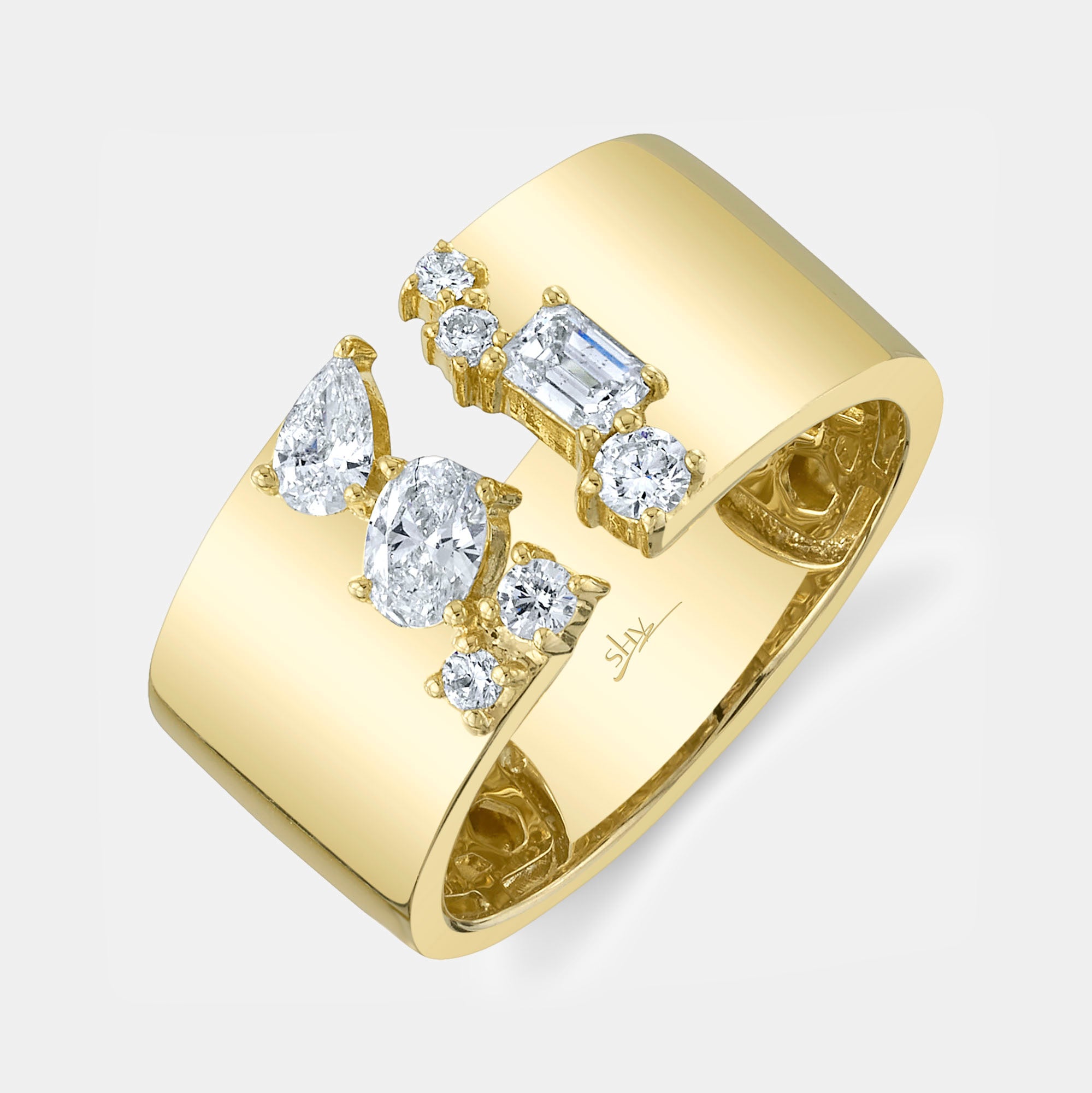 Yellow gold emerald pear and oval shaped diamond cocktail ring, top angle view