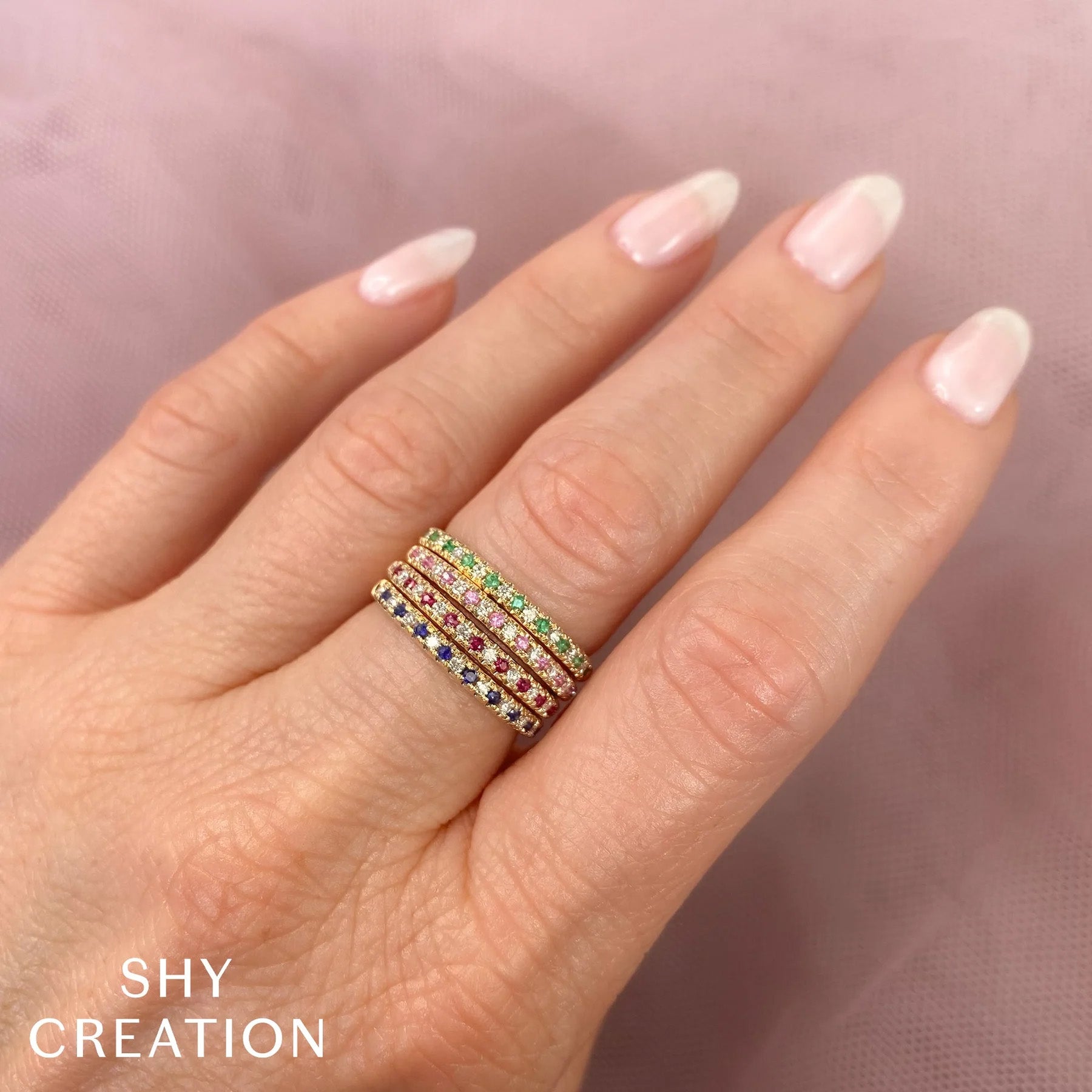 Woman wearing white gold diamond and sapphire fashion ring