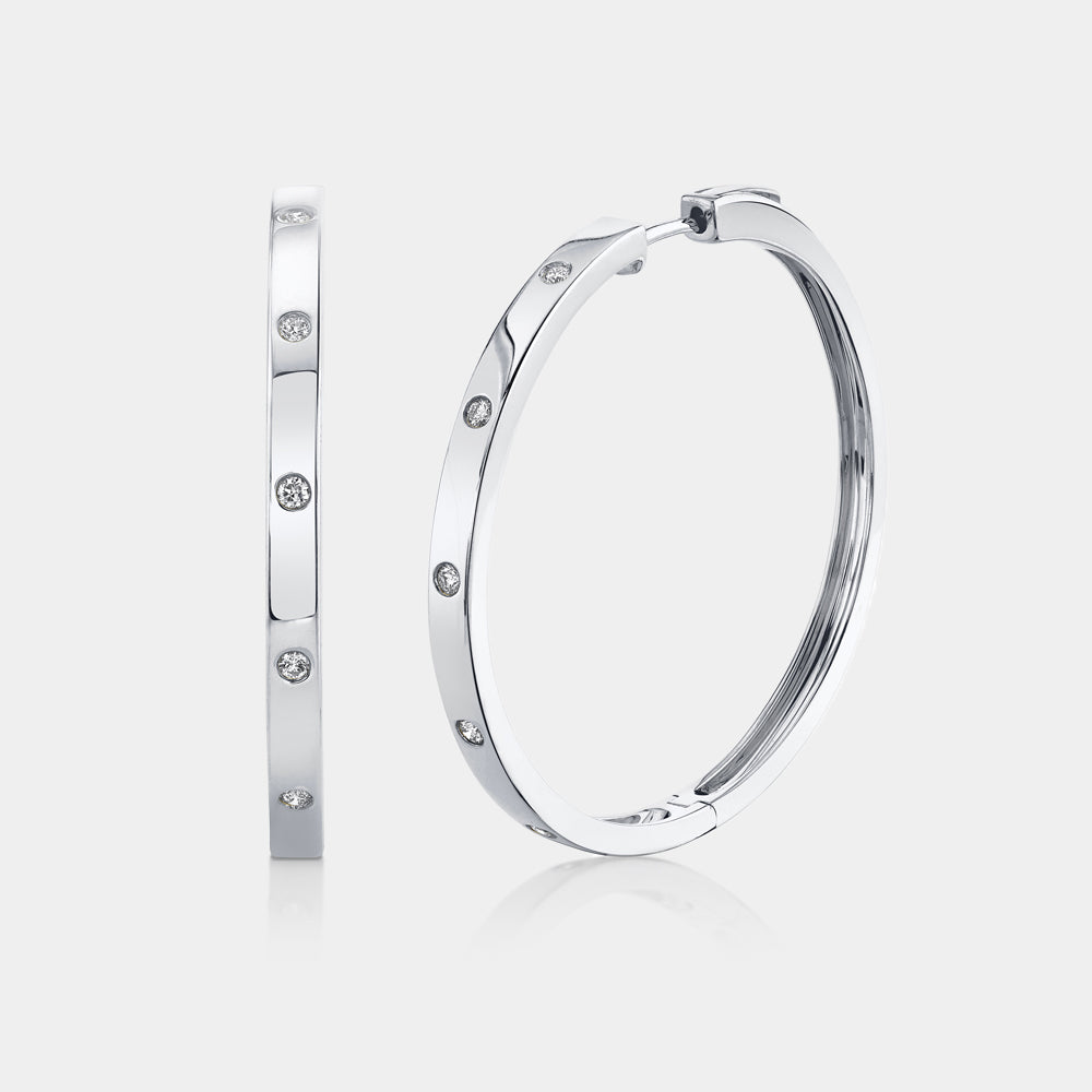 White gold diamond bezel set hoop earrings, front angle view