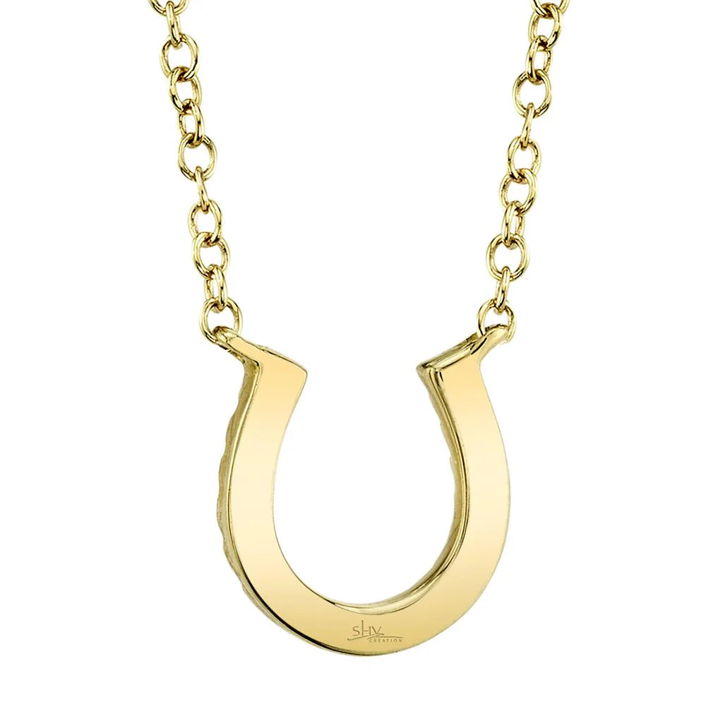 Yellow gold diamond horseshoe necklace, back view of polished pendant