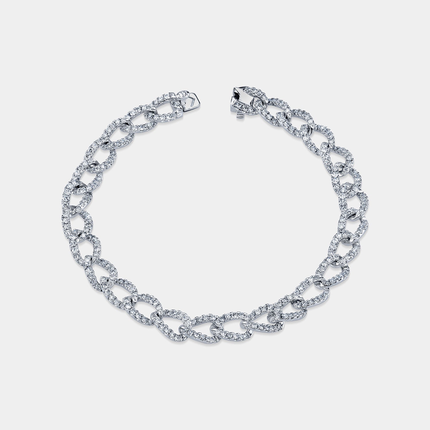 18K white gold diamond curb link bracelet featuring round pavé-set diamonds, shown on a grey background in a flat front angle view.