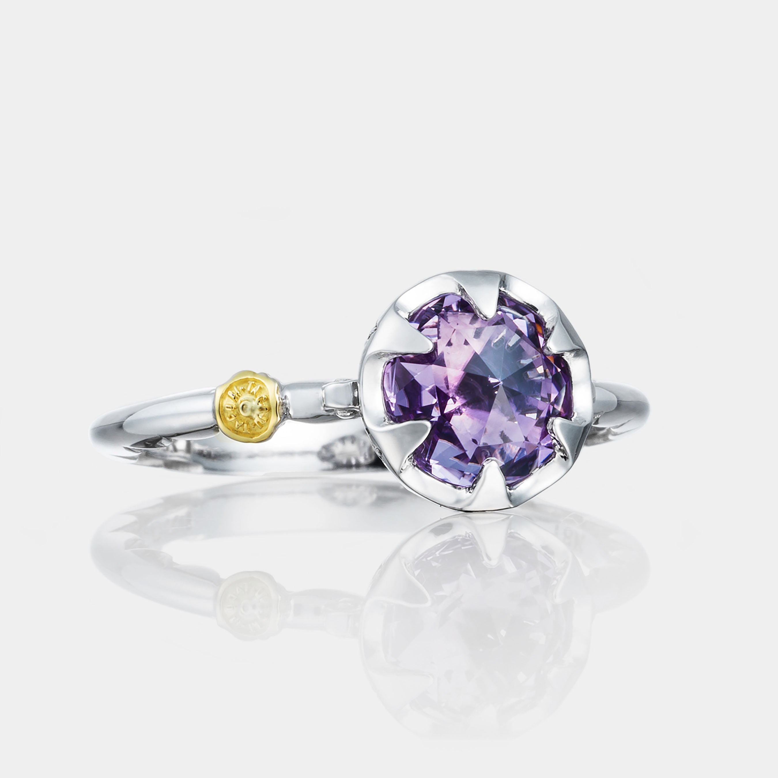 Sterling Silver and White Gold Amethyst Ring on grey background.