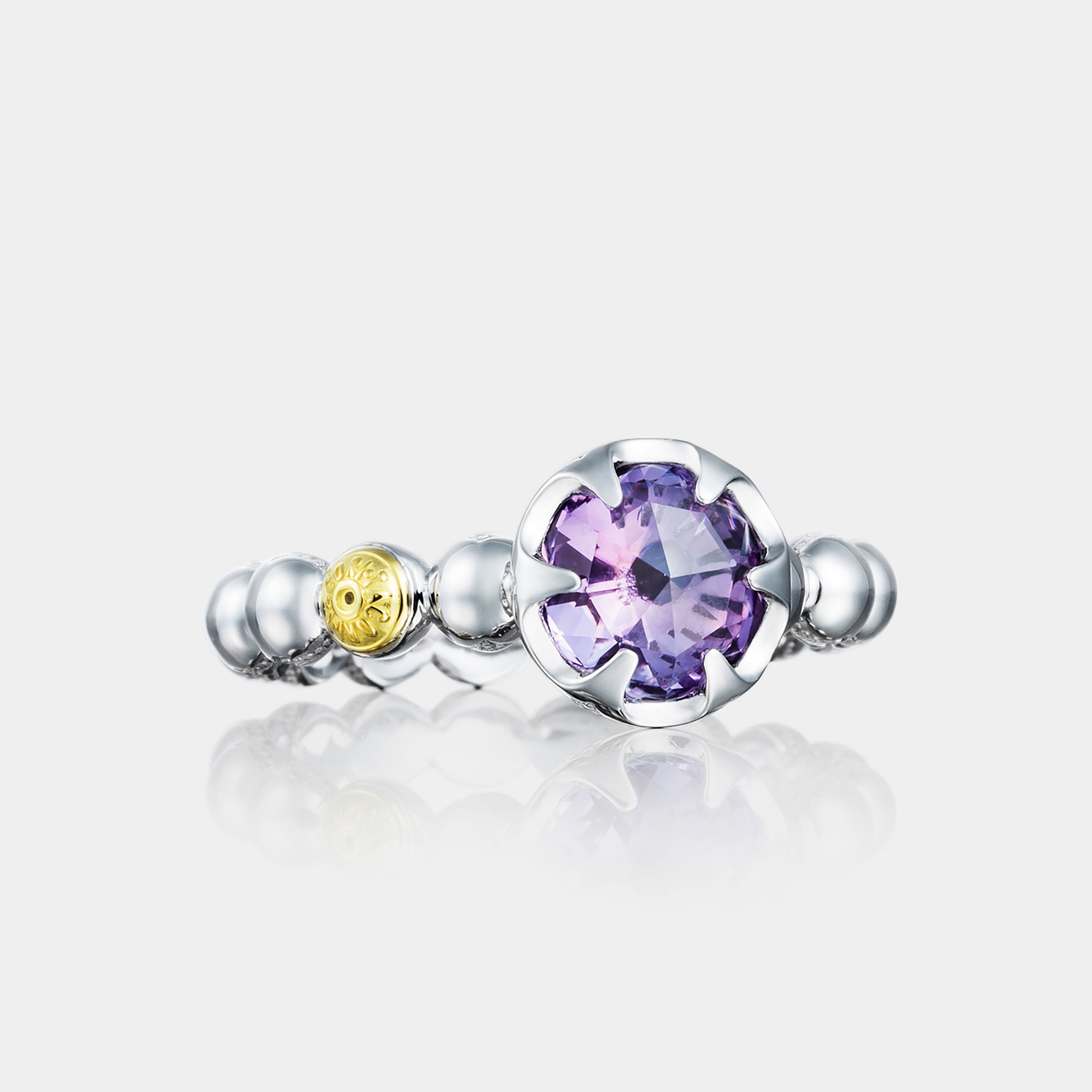 Sterling Silver and White Gold Round Amethyst Ring on grey background.