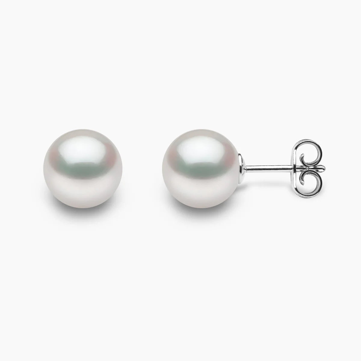 Pair of pearl earrings on a light gray background, front and side angle