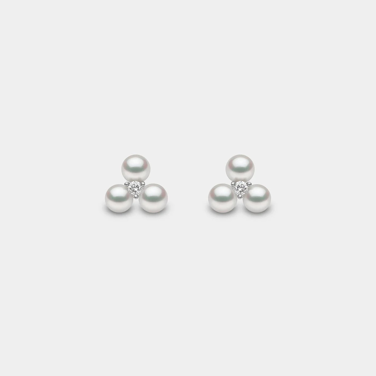 Triple pearl diamond stud earrings, front view
