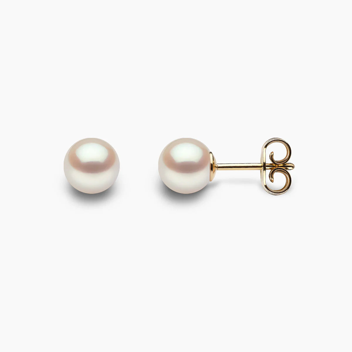 Classic pearl stud earrings in yellow gold, front and side angle view