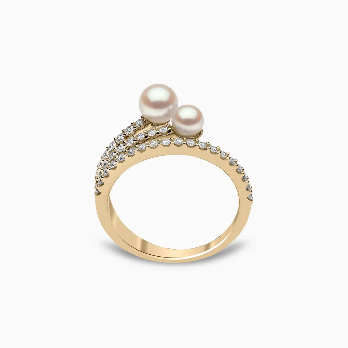 Yellow gold pearl and diamond twist fashion ring on grey background, front view